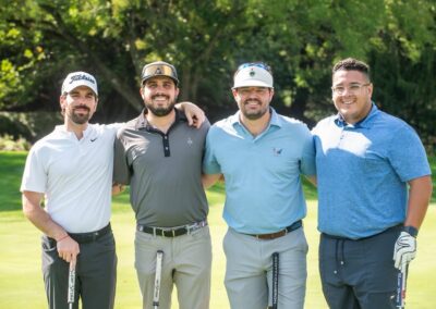 Group of golfers posing at fundraising event