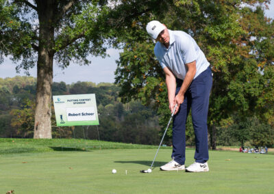 Man on golf course during fundraiser event