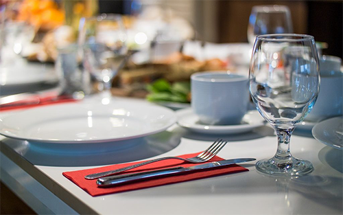 Beautiful dinner table formally set up for gala fundraiser